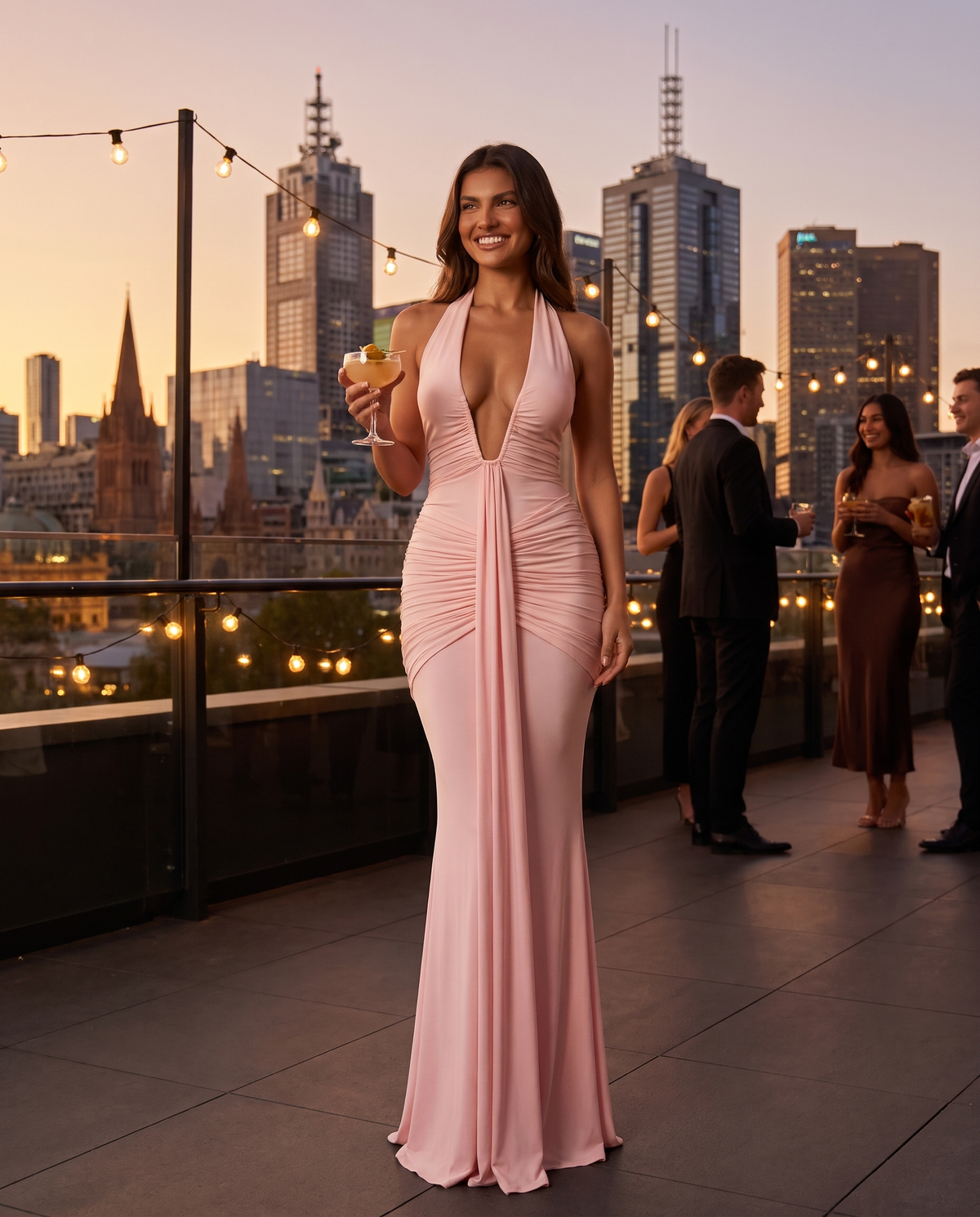 Aurora Plunge Maxi Dress in Blush Pink at a city rooftop bar