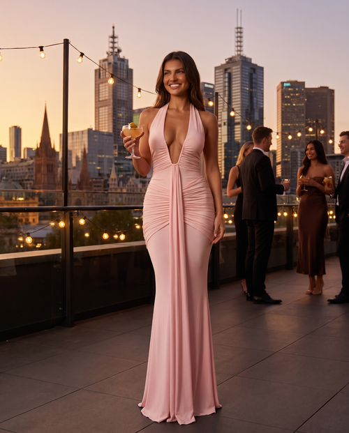 Aurora Plunge Maxi Dress in Blush Pink at a city rooftop bar