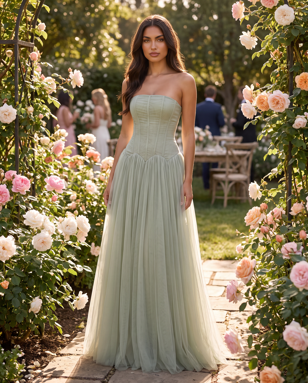 Arabella Pleated Maxi Dress in Sage Green in a rose garden at a wedding